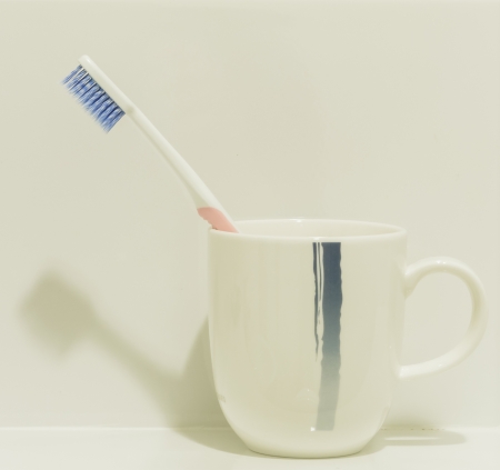 Tooth brush in a cupの写真素材