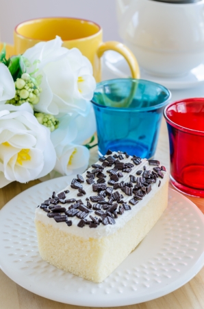 Vanilla Cake in white dish on the wood tableの写真素材