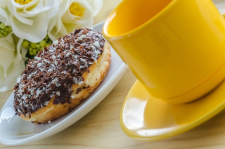 Chocolate donut on a white dishの写真素材