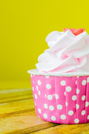 Pink Cupcake on color backgroundの写真素材