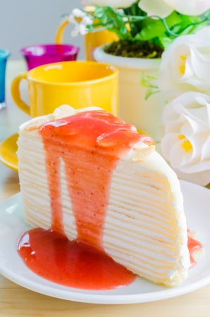 Strawberry crepe cake on white dishの写真素材