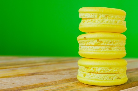 Lemon macaroon on green backgroundの写真素材