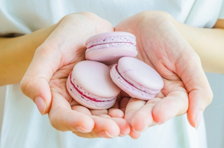 Macaroon in the handの写真素材