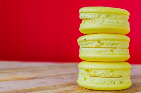 Lemon macaroon on red backgroundの写真素材
