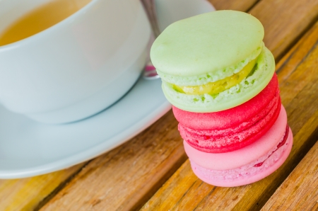 Colorful macaroon with white cup teaの写真素材