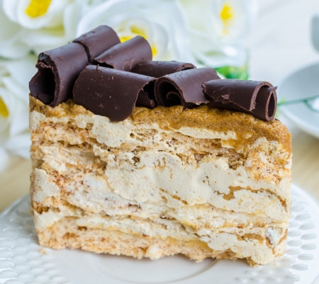 Coffee cake in white dish on the wood tableの写真素材
