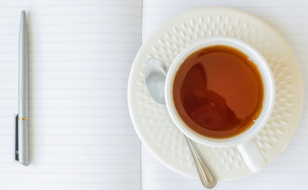 Paper note with white cup teaの写真素材