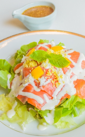 Salad salmon in white dishの写真素材