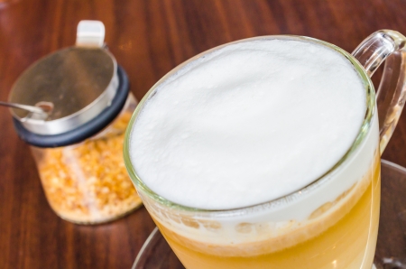 Hot Caramel macchiato with brown sugar on the wood tableの写真素材