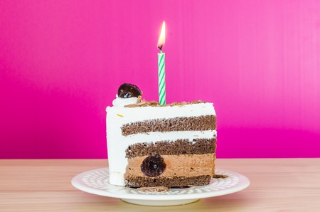 Chocolate cake with black cherry in white dish&colorful backgroundの写真素材
