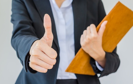 business woman showing thumbs upの写真素材
