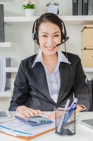 Business women with headphoneの写真素材