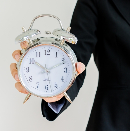 Clock on bussiness handの写真素材