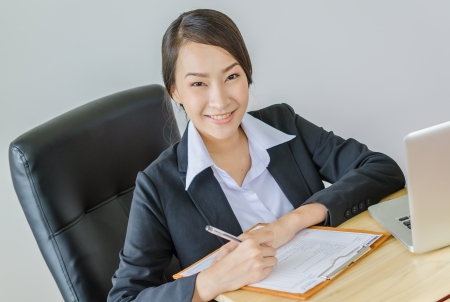 Business women smile with laptopの写真素材