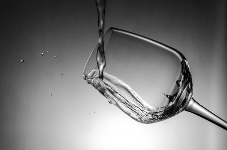 Water splash with wine glassの写真素材