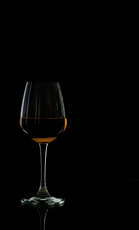 Wine glass on black wallpaperの写真素材