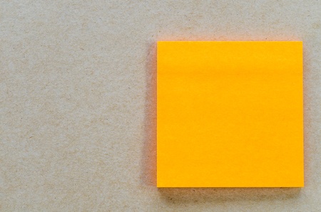 Color paper note on the brown backgroundの写真素材
