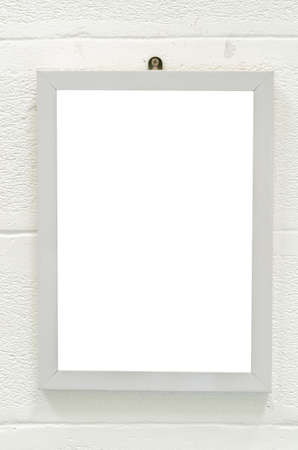 Empty wood frame on white wall