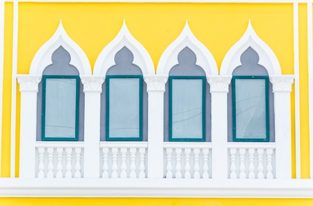Beautiful window on color wall
