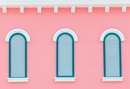 Beautiful window on color wall