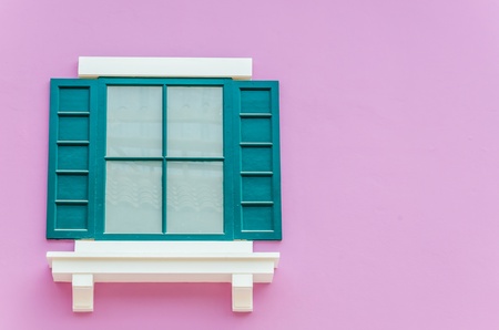 Beautiful window on color wall