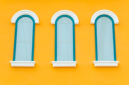 Beautiful window on color wallの写真素材