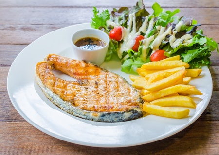 Salmon Steak on wood tableの写真素材