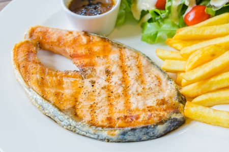 Salmon Steak on wood tableの写真素材