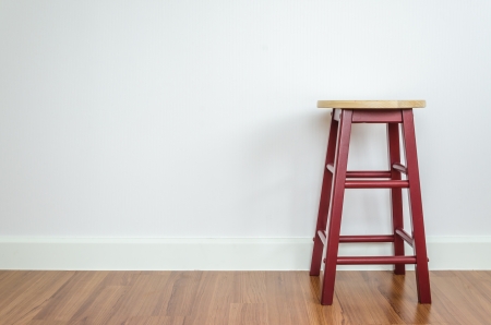 Wood chair with white wallpaperの写真素材