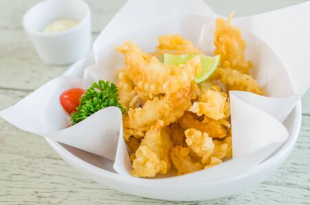 Fried Squid on wood tableの写真素材