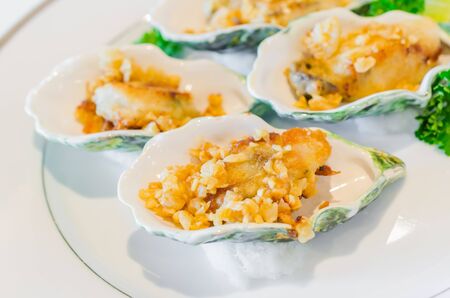 Oyster fried with garlicの写真素材