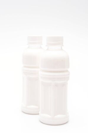Milk bottle on white backgroundの写真素材