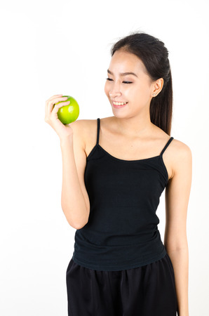 Sport girl with green appleの写真素材