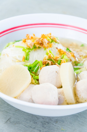 Meat ball noodles in white bowlの写真素材