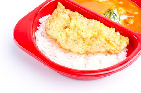 Red curry rice and fried eggの写真素材