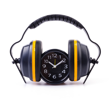 Ear phones , clock on isolated white の写真素材