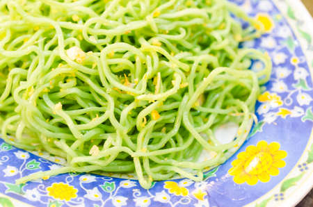 Green pasta and garlicの写真素材