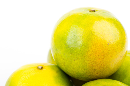 Green orange on isolated white backgroundの写真素材