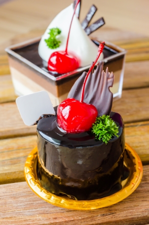 Chocolate cake with cherry on topの写真素材