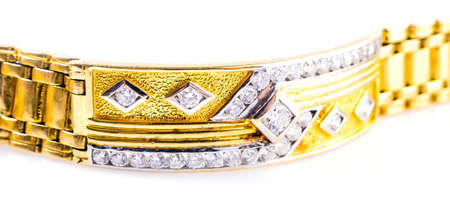 Gold bracelet on isolated white background