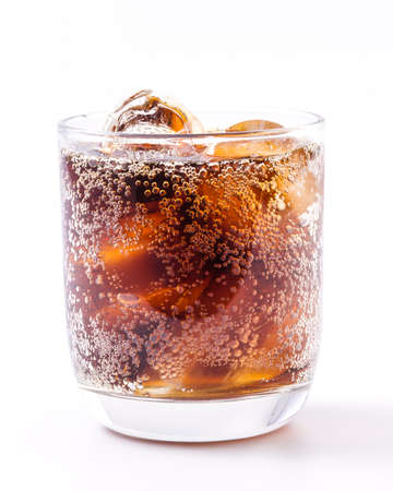 Cola in glass on isolated white backgroundの写真素材