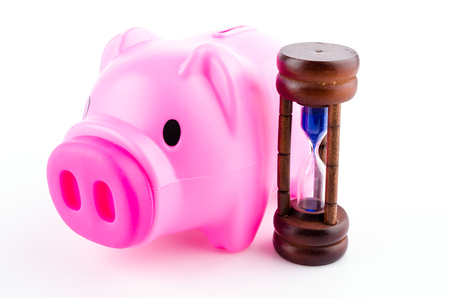 piggy bank sand clock isolated white の写真素材