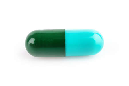 Capsule pills isolated white backgroundの写真素材