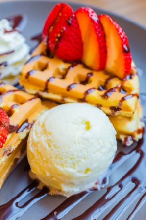 Pancake with strawberry on top and icecreamの写真素材