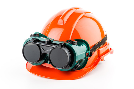 Safety helmet and goggles glasses isolated on white backgroundの写真素材