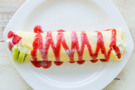 Pancake roll with strawberry and kiwiの写真素材