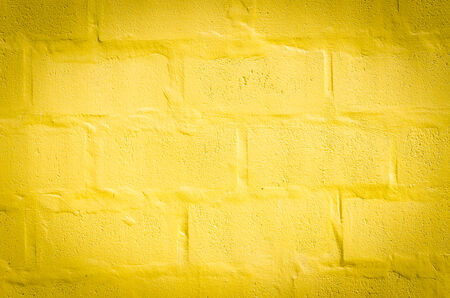 Old yellow wall texture backgroundの写真素材