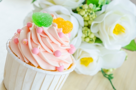 Strawberry cupcake on wood tableの写真素材