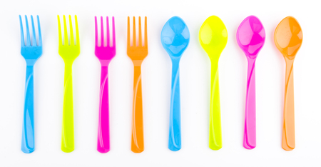 color spoon fork dish plastic isolated white backgroundの写真素材