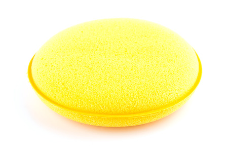 Yellow sponge isolated on white backgroundの写真素材